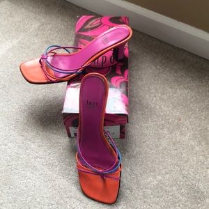 Multi color strapped heels.